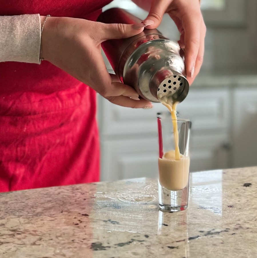 Pouring Butterscotch Shot Into Shot Glass