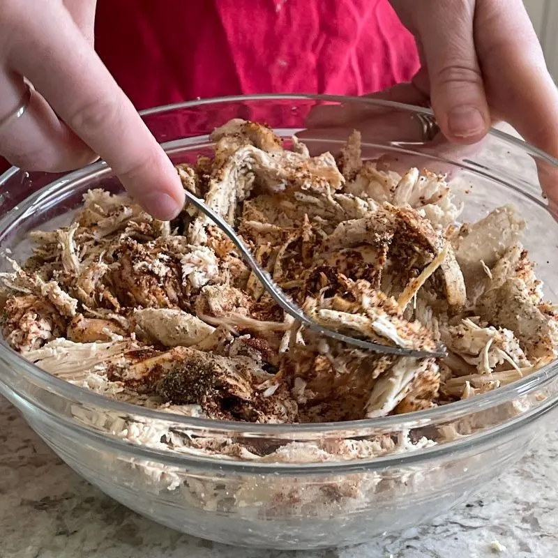 Stirring Chicken And Spices Mixture