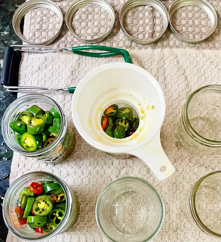 Sweet And Spicy Candied JalapeÑOs 4 Filling Jars With A Canning Funnel-Candied Jalapenos