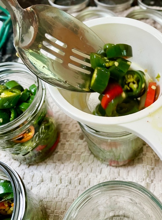 Filling Jars With Candied Jalapenos