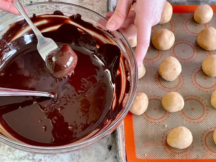 Dipping Truffles In Melted Chocolate
