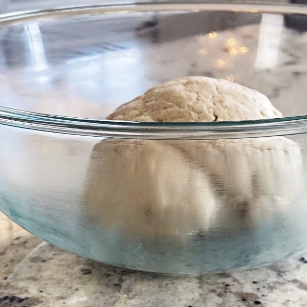 Pizza Dough Ball In Greased Bowl.
