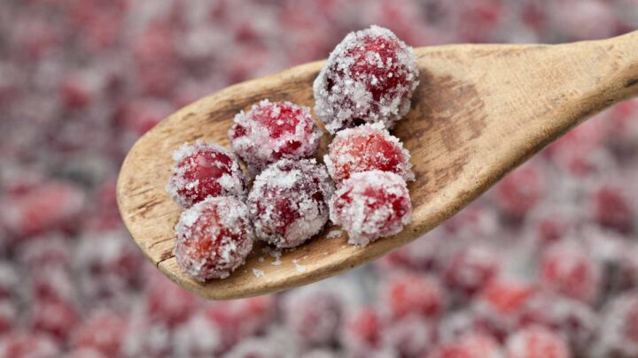 Sugared Cranberries On Wooden Spoon