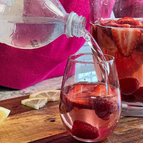 Adding Sparkling Water To Pink Sangria Recipe