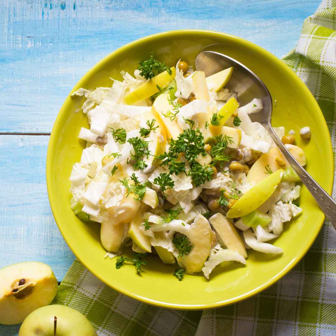 Apple Cabbage Salad in a green bowl