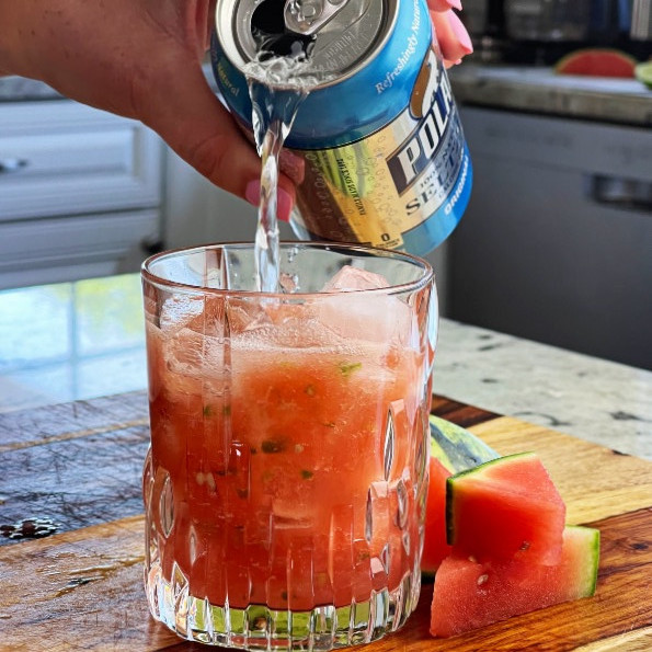 Pouring Seltzer Water Into Watermelon JalapeÑO Pulp
