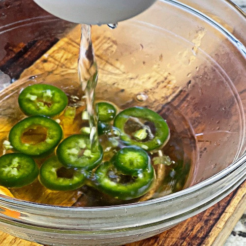 Pouring Agave Nectar Over JalapeÑOs Slices