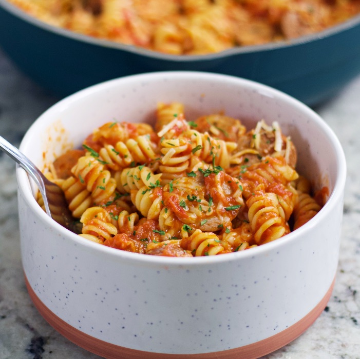 pasta sausage dinner in a white bowl