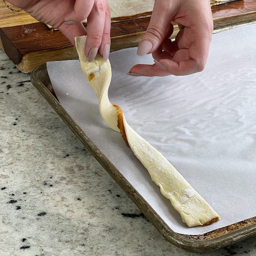 Twisting Pumkin Pie Twists On Baking Sheet