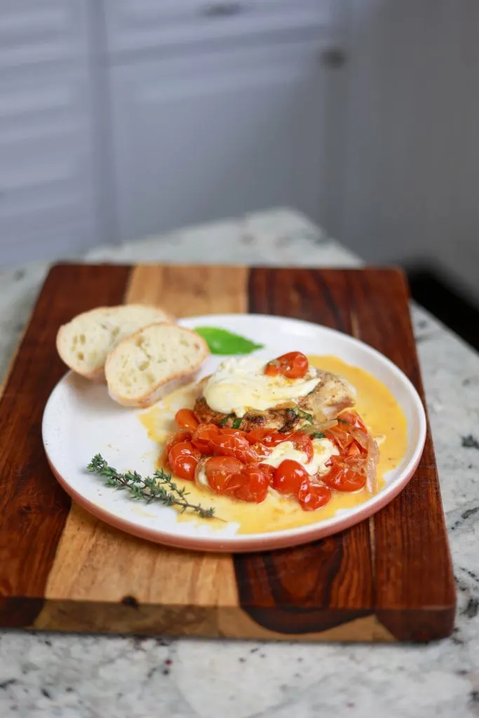 Pair Pan Fried Chicken And Tomatoes With Bread