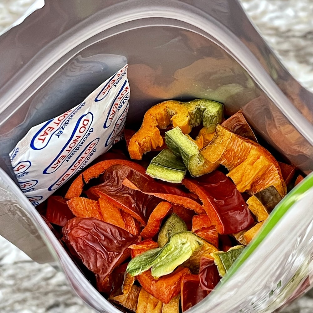How Does Freeze Drying Work? 6 open mylar bar filled with freeze dried peppers with an O2 aborber