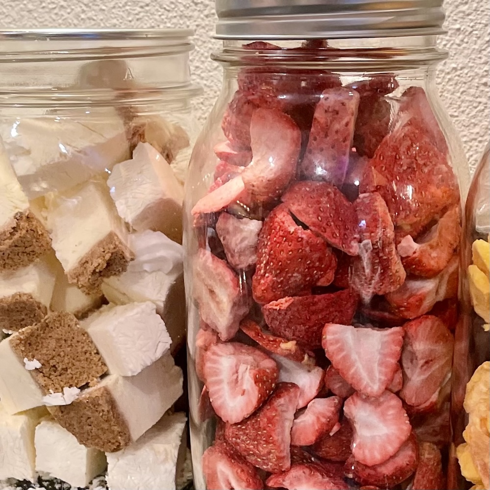 Freeze Drying Food Safety: How to Preserve Food Safely at Home 20 freeze dried foods in canning jars on a counter. sealed and freeze dried for freshness with safe home freeze drying practices.