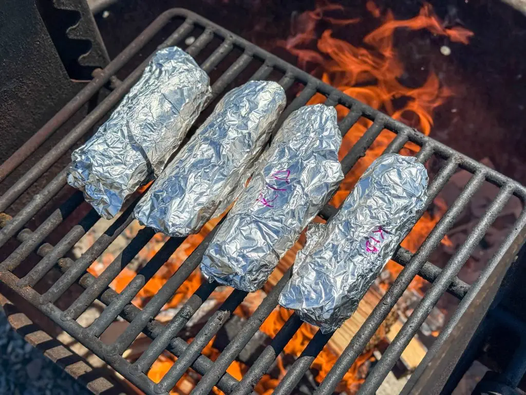 Make-Ahead Camping Breakfast Burritos: Easy, Freezer-Friendly Recipe 1 Making Breakfast Burritos Over Campfire