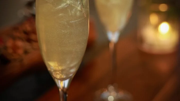 white cranberry mimosa with edible glitter