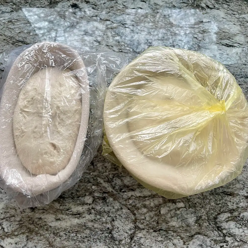 How to Proof Sourdough Bread: Timing, Temperature, and Signs of Under/Overproofing 8 Two sourdough loaves covered for an overnight cold proof in the refrigerator