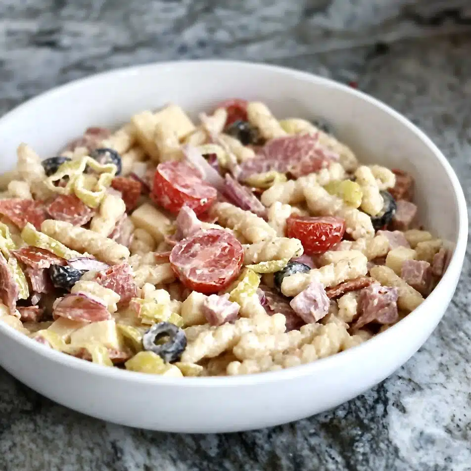 Creamy Italian Grinder Pasta Salad 8 add in all the meats, cheeses and vegetables, except the lettuce