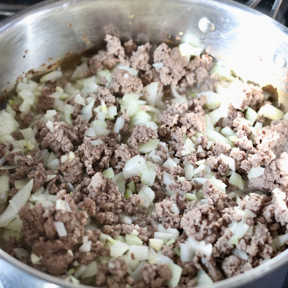 Easy One Pot Ground Beef Stroganoff 7 building creamy ground beef stroganoff with egg noodles in a skillet