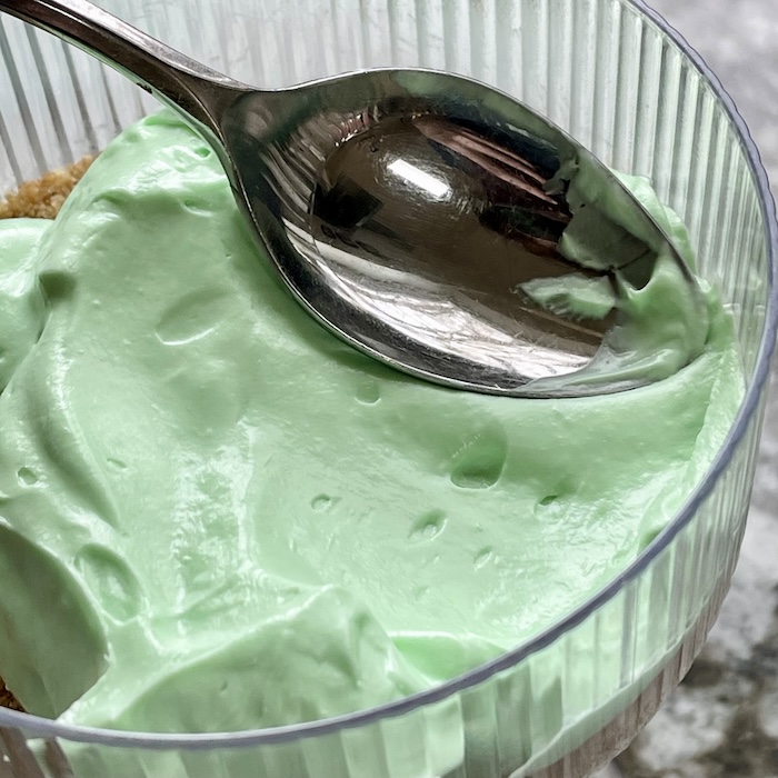 Adorable No Bake Easter Cheesecake Cups 7 smooth the top of the cup with a spoon