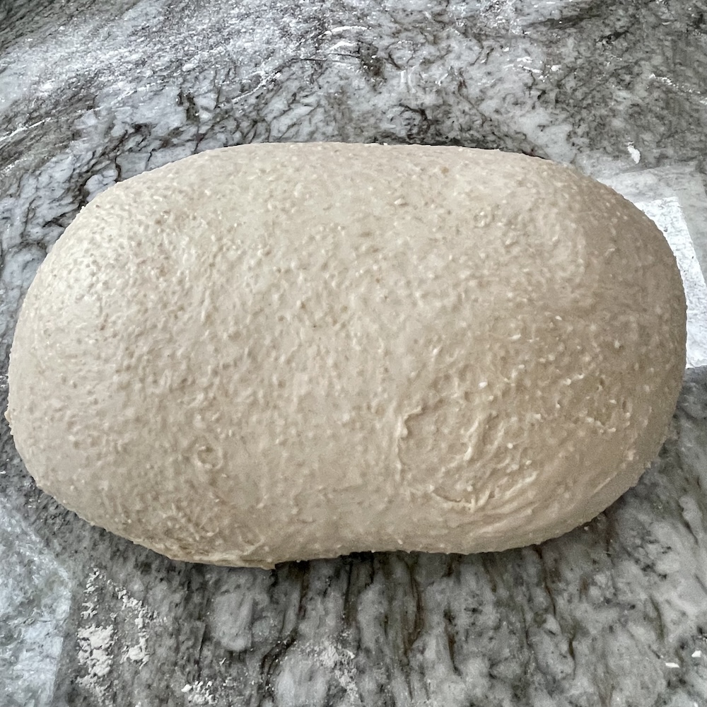 How to Shape Sourdough Bread (Build Tension for Better Oven Spring and Crumb) 25 how to shape sourdough bread. a dough showing tears from over stretching