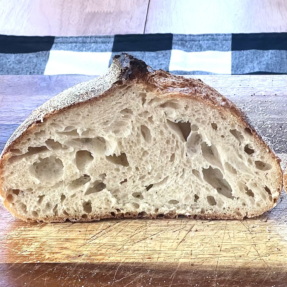 open sourdough crumb-loaf cut in half