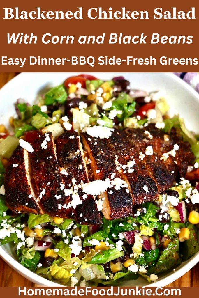 Blackened Chicken Salad with Corn and Black Beans 24 pictured is blackened chicken salad with corn and black beans in a white bowl with chicken slices arranged across the top.