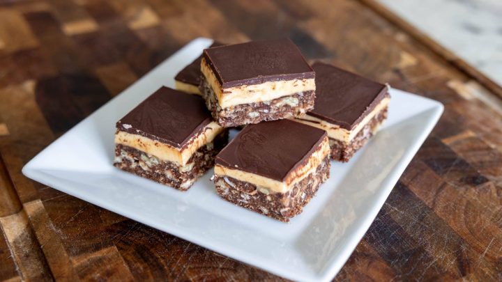 Nanaimo Bars on a plate with one stacked on top